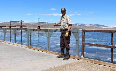 Deputy Refuge Manager Cortez Rohr adjusts release gates on the Lower Red Rock Lake water control structure