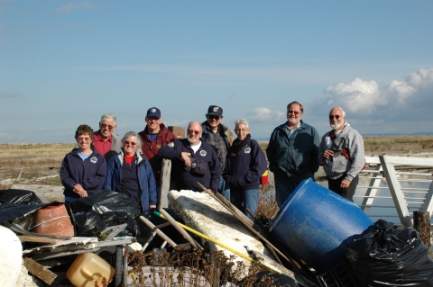 Volunteers Pose for a Group Photo After Collecting Debris on Protection Island