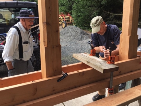 Two Volunteers Building a Bench