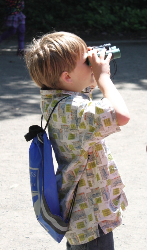 A Boy Peers Through His New Binoculars
