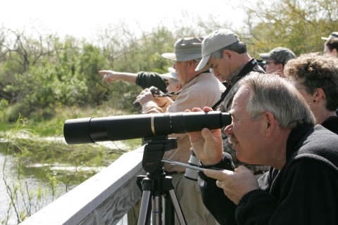 Visitors are birdwatching at an impoundment viewing platform at Santee NWR.