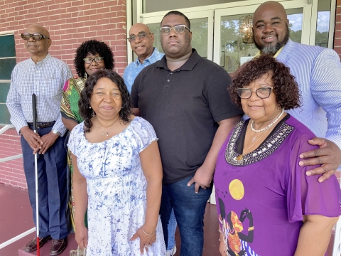 Close-up group shot in front of the church.