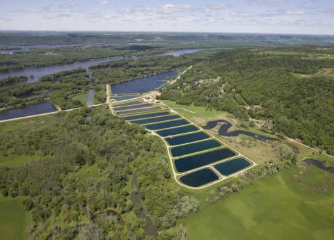 Aerial view of Genoa National Fish Hatchery-with 20 ponds, highway and backwaters of the Mississippi River next to it. 