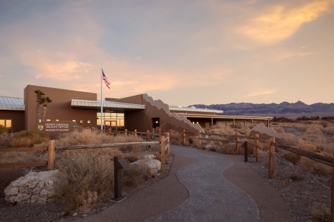 Front of Corn Creek Visitor Center at Desert National Wildlife Refuge. Mountains visible in the distance.