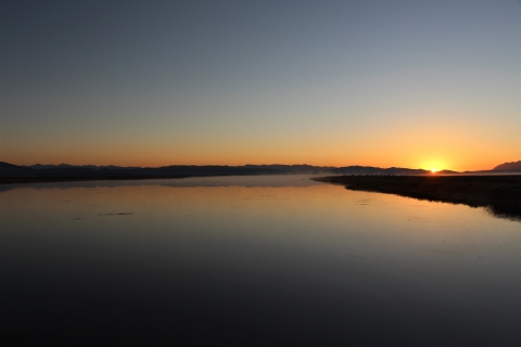 A colorful sunrise over a lake