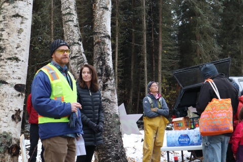 man in a high visibility jacket talking 