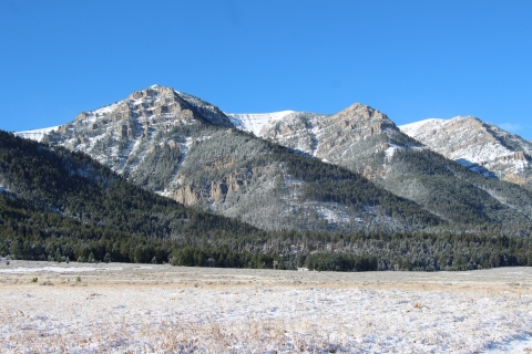 Morning sunrise on the Centennial Mountains at Red Rock Lakes National Wildlife Refuge under brilliant blues skies with light snow