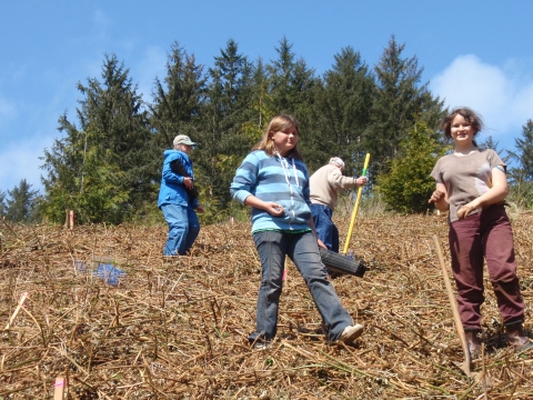 Students from the Jane Goodall Environmental Middle School plant trees at Nestucca Bay Wildlife Refuge
