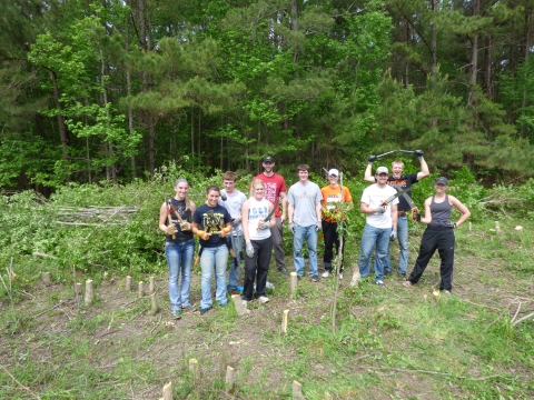 Ten Wartburg College students clear forest area at Santee NWR