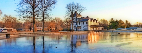 Winter morning scene of the visitor center reflecting in the pond