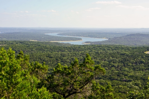 Lake Travis in the distance surrounded by ashe juniper trees