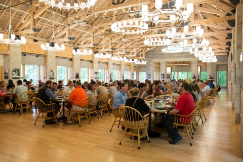NCTC dining hall filled with table with people eating and in conversation