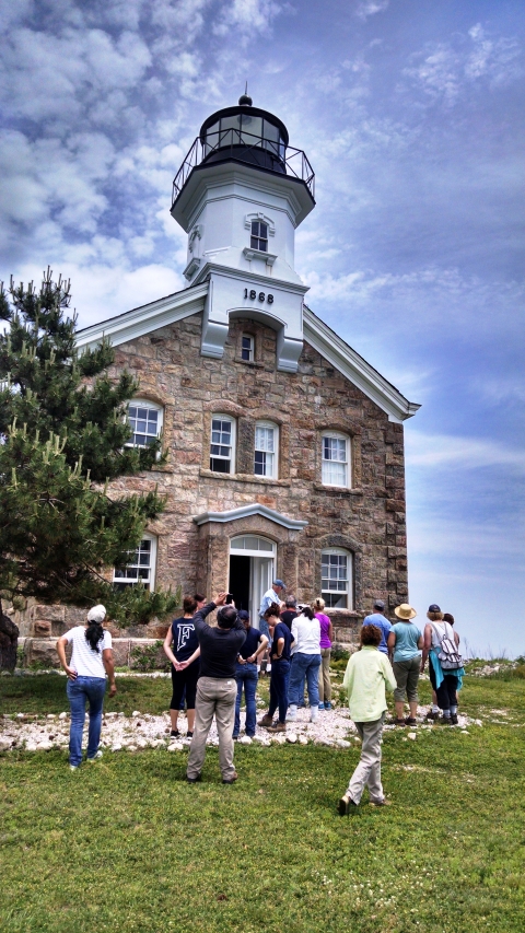 Sheffield Island lighthouse with visitors awaiting entry