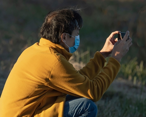 A person taking a photo with their cell phone