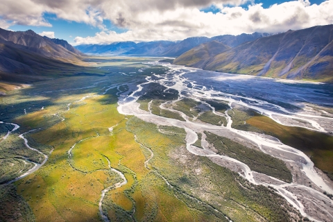 Striking aerial photo of a river bed running between mountain ranges in Alaska.