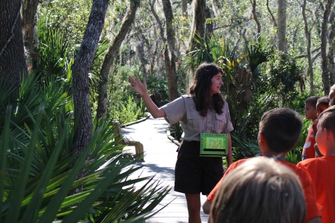A U.S. Fish and Wildlife Service ranger leads a group of elementary school children on an outdoor experience