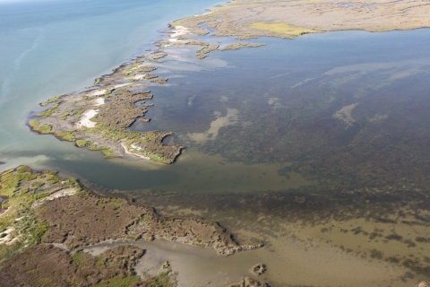 Aerial view of breach and coastal flooding.