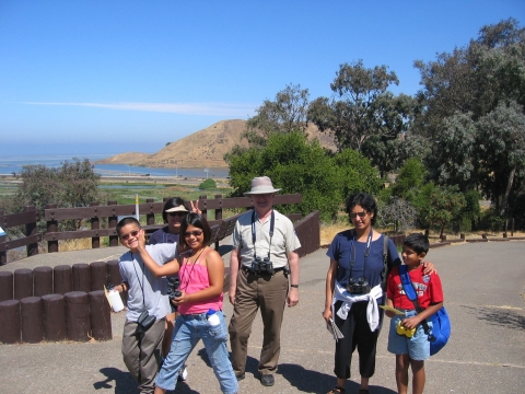 A family enjoys a bird walk along the Tidelands Trail at Don Edwards San Francisco Bay National Wildlife Refuge.