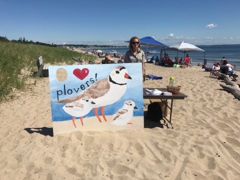 Intern conducts public outreach at Rachel Carson NWR on beach in Maine. 
