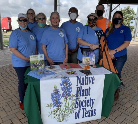 Picture of people in front of Native Plant Society of Texas table