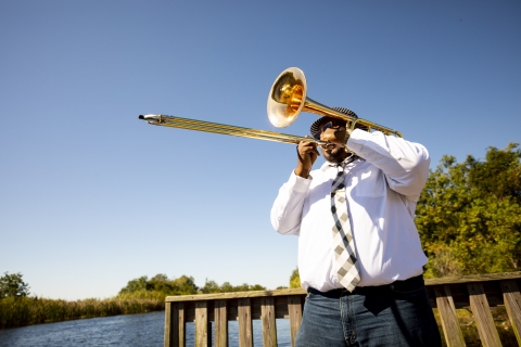 A man plays the trumpet at Bayou Sauvage National Wildlife Refuge in New Orleans.
