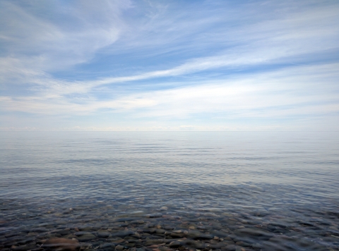 Rocks at the bottom of Lake Superior show through the clear water
