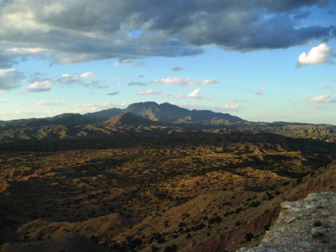 A distant view of Ladrone Peak with a desert landscape in the foreground.