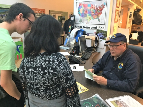 Front desk volunteer assists visitors at Savannah NWR