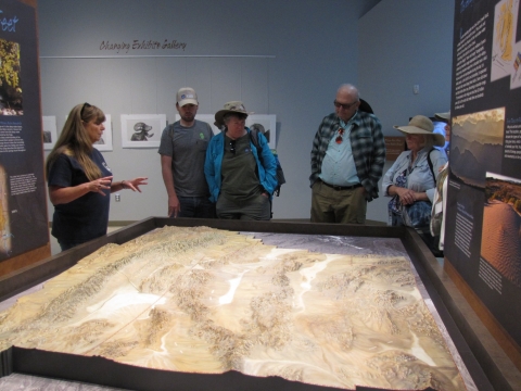 Volunteer giving an interpretive talk to a group of visitors