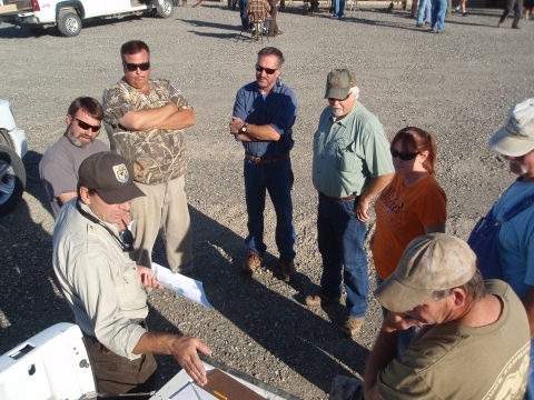 biologist and partners discussing management