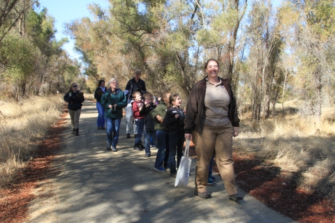 ranger leading group of kids on walking trail
