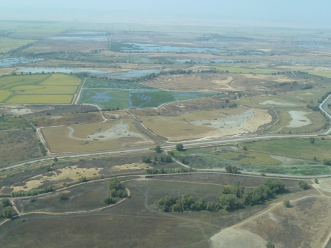 aerial photo of willow creek wildlife management area. different shades of brown, green, and blue