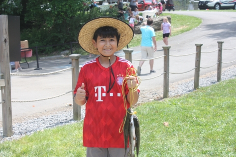 child holding a stringer of trout