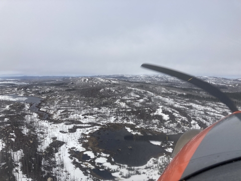 Aerial view of snow on the landscape with wetlands