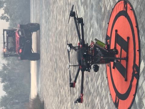 Drone with ATV in background