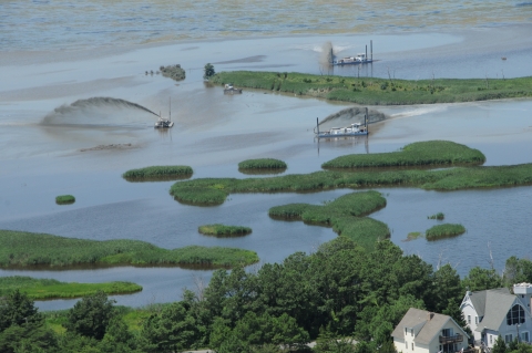 Aerial photo of dredge units in open coastal marshland