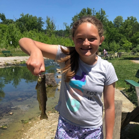 Girl holding a trout