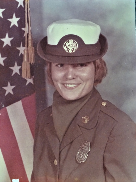 a woman smiles in uniform