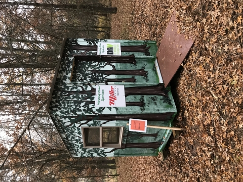 Photo of enclosed hunting blind sitting in the woods