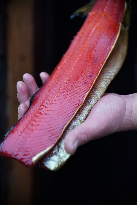 a smoked fillet of salmon in hand