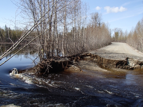 A road in Tyonek, Alaska has been washed out due to high waters and a culvert that was too small to handle the flow.