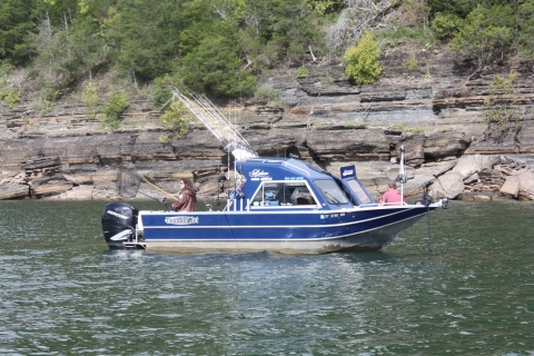 Blue striper guide boat on a lake