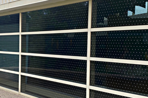 Large window panel filled with dotted film