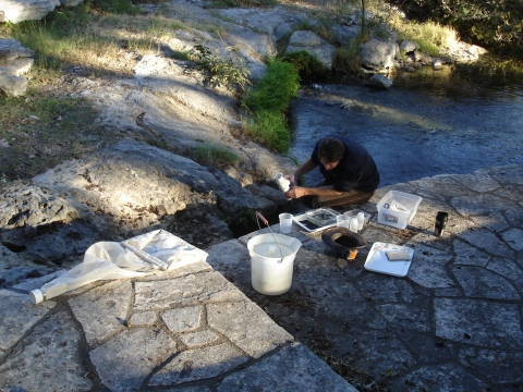 A biologist setting up a drift net for a groundwater invertebrate survey