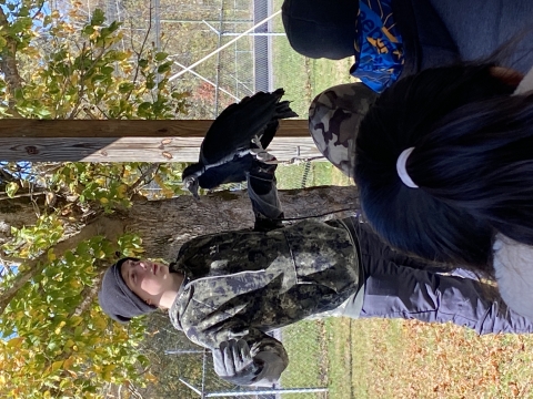 man talking to students about a rescued vulture