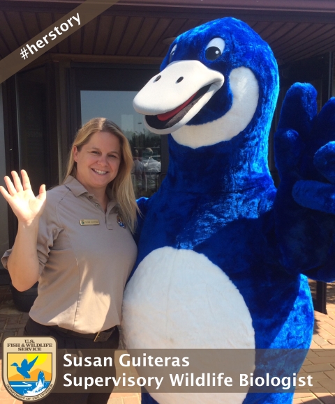 Susan stands side by side with the blue goose 