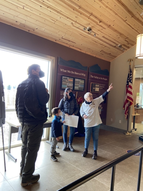 A volunteer points out features at the Canaan Valley NWR visitor center