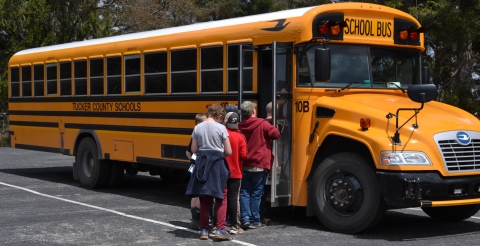 A school bus loading with students after Wild School field trip at Canaan Valley NWR