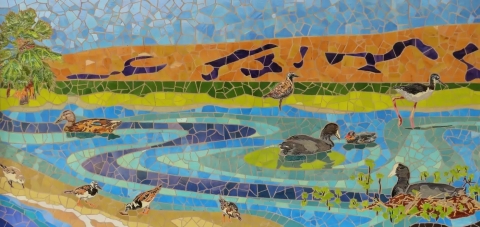 Colorful mosaic mural depicting different native waterbirds, waterfowl, and migratory shorebirds.