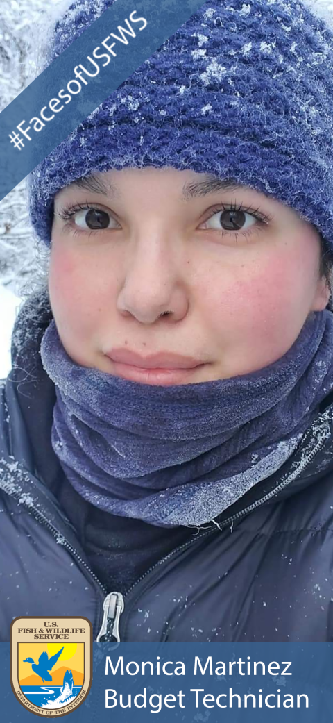 A woman wearing a purple snow covered hat, scarf and jacket. A banner in the top left corner says "#FacesofUSFWS". The USFWS logo appears in the bottom left corner. A banner across the bottom says "Monica Martinez, Budget Technician".